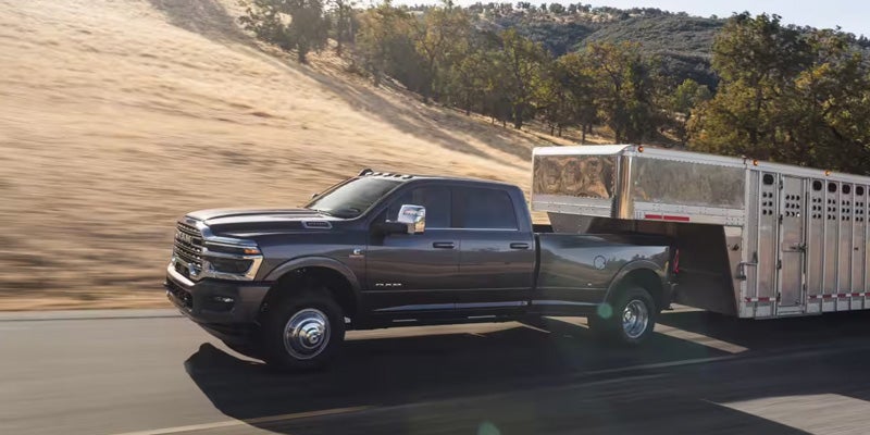 2026 RAM 1-ton towing a livestock trailer